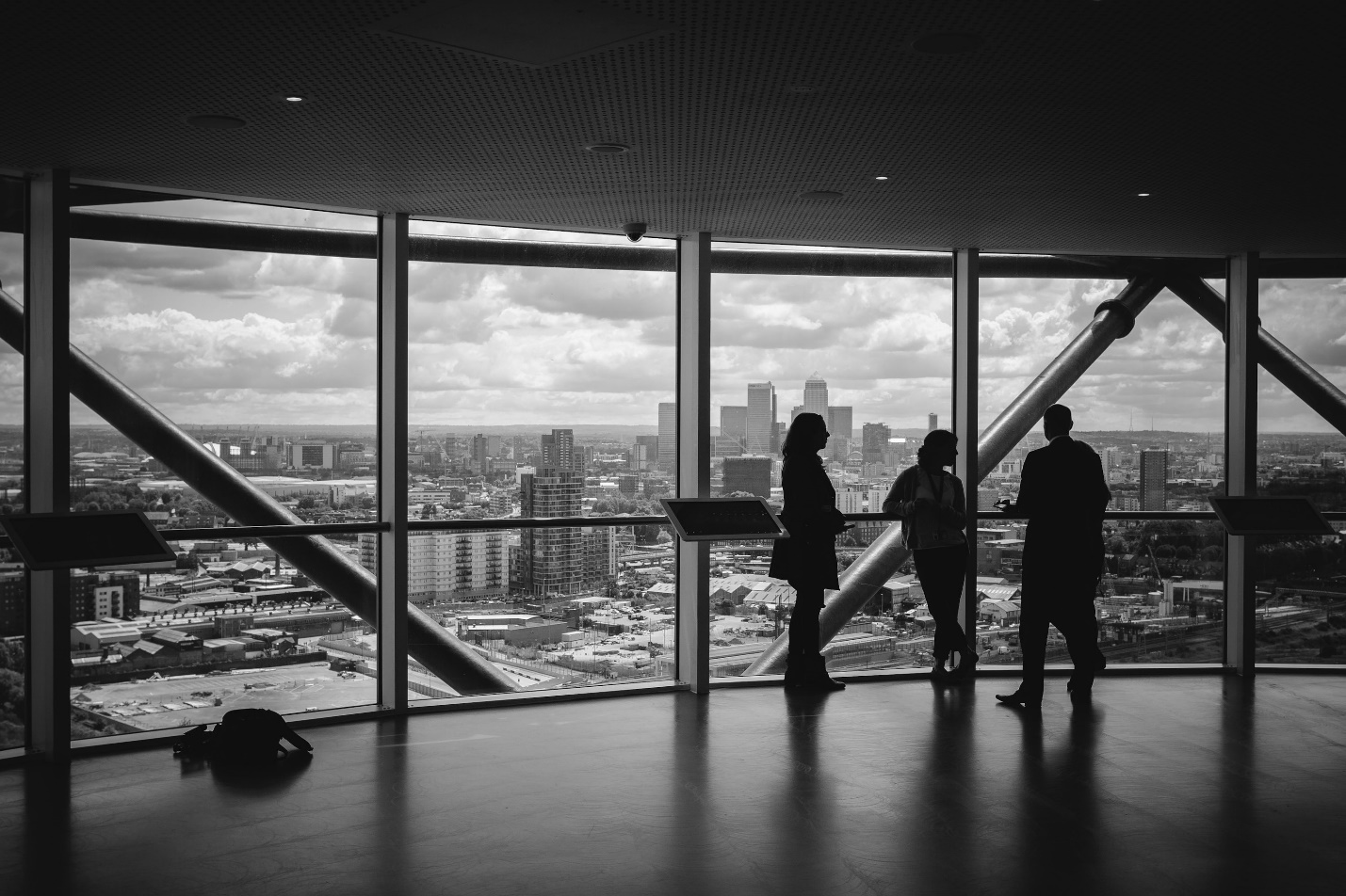 People in an office looking at the city