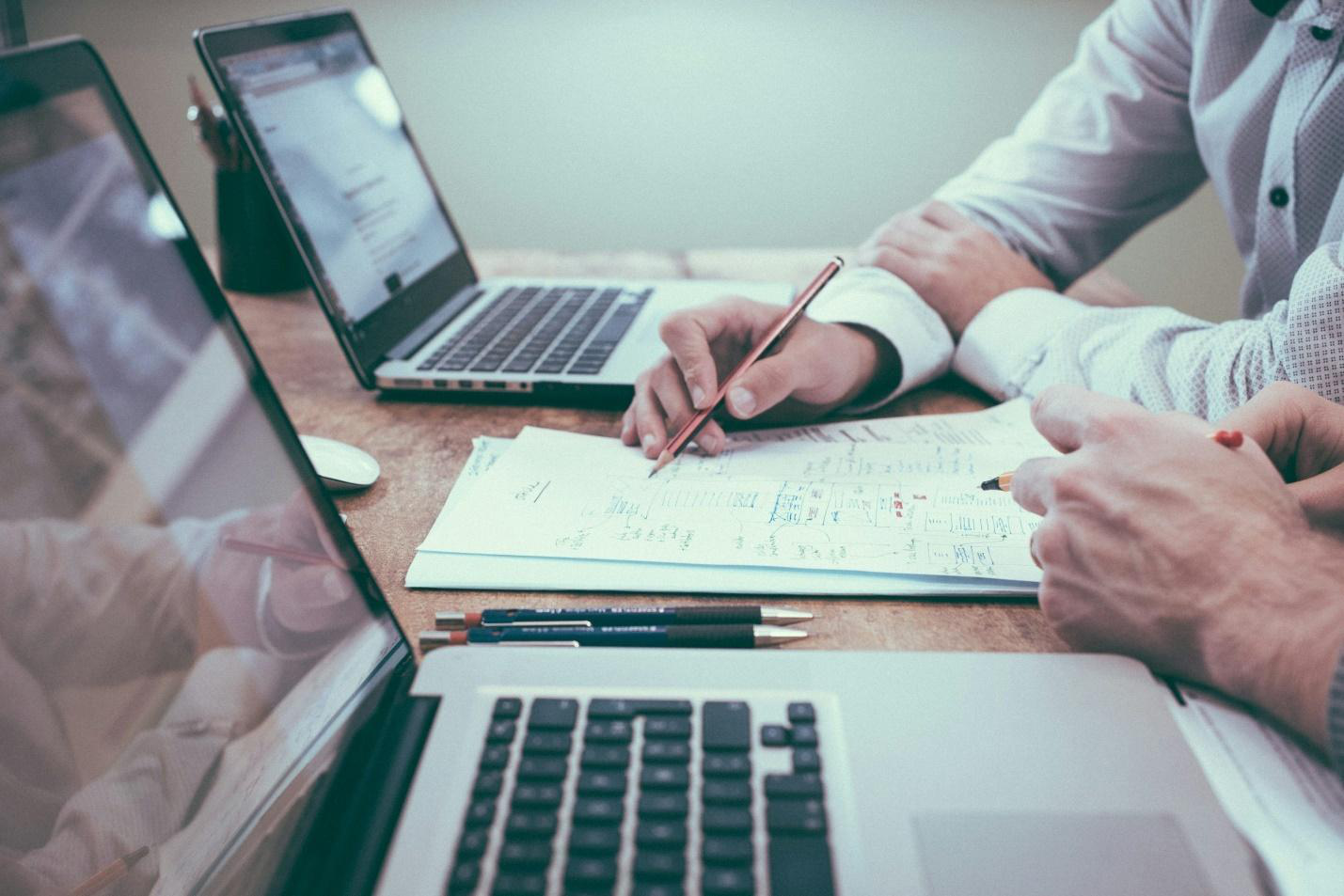 Cropped photo of a businessman working with a risk management expert