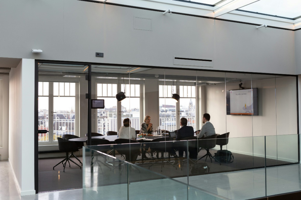  Executives conducting a meeting, discussing employees’ financial health