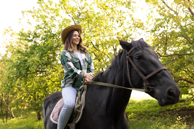 a woman riding a horse