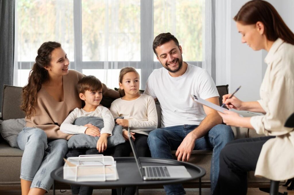 A picture of a family having a consultation with an insurance agent