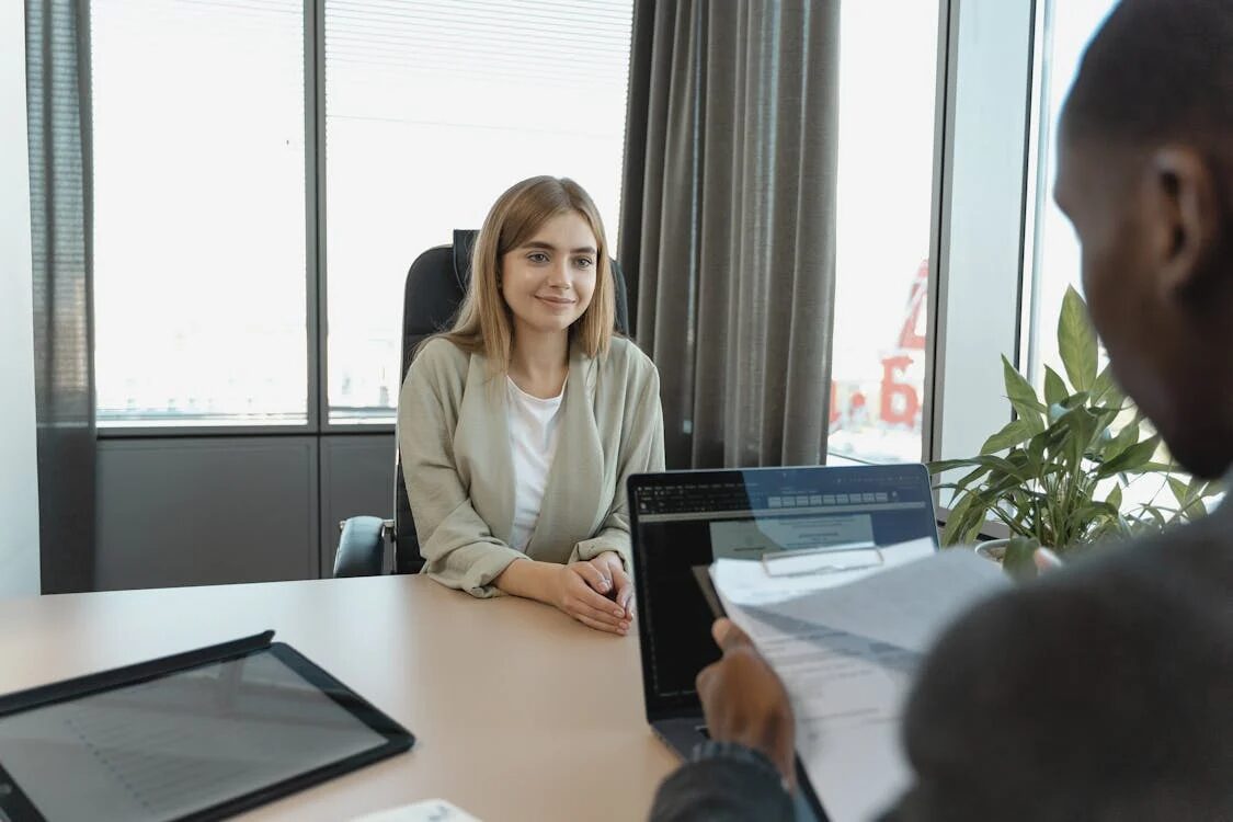  two people in an office space.