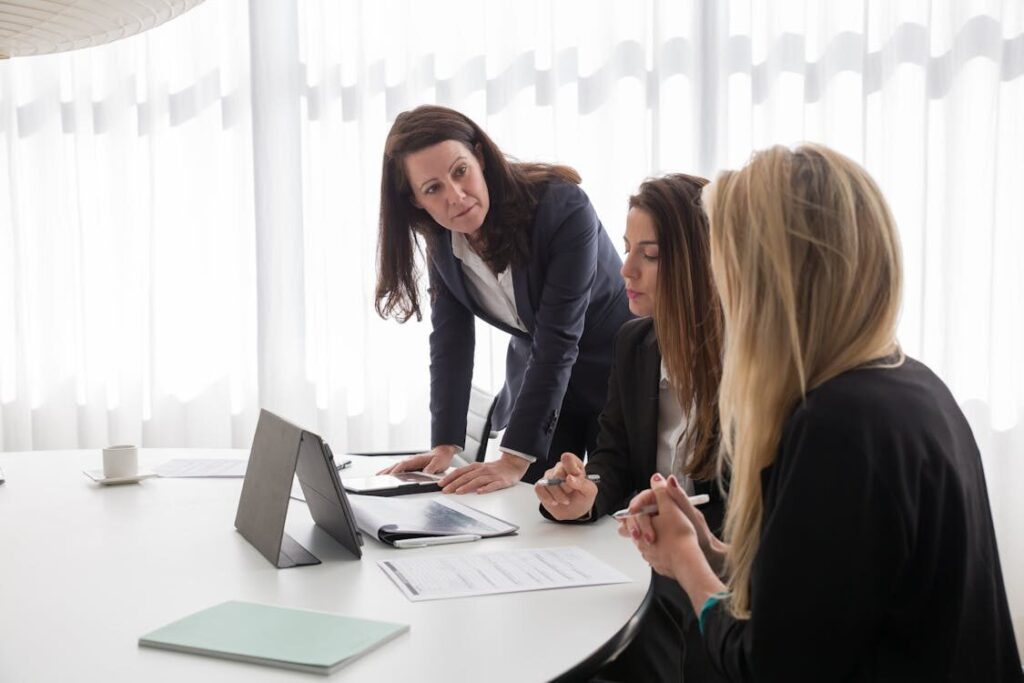 three women in an office space