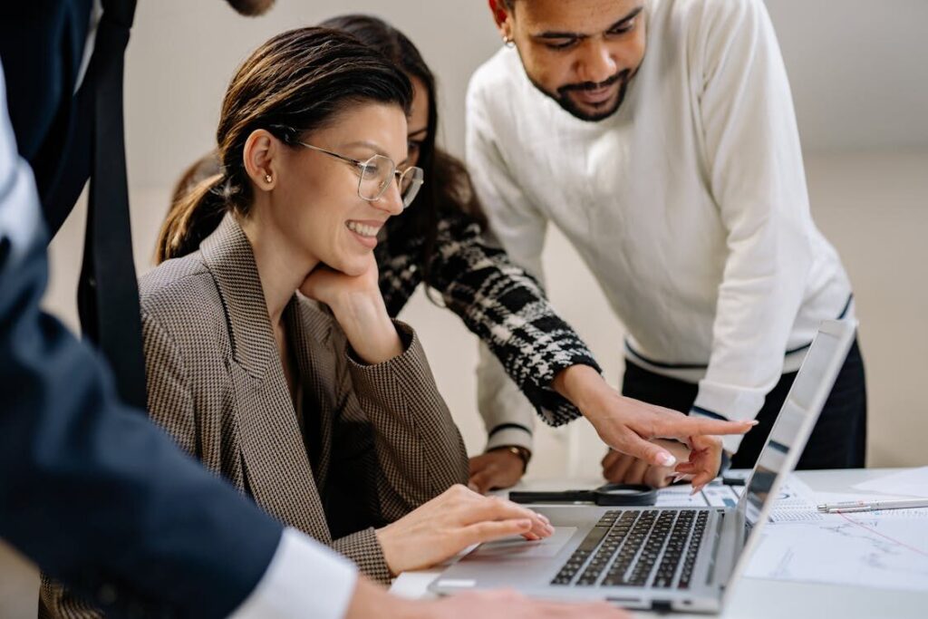 employees working on a laptop.